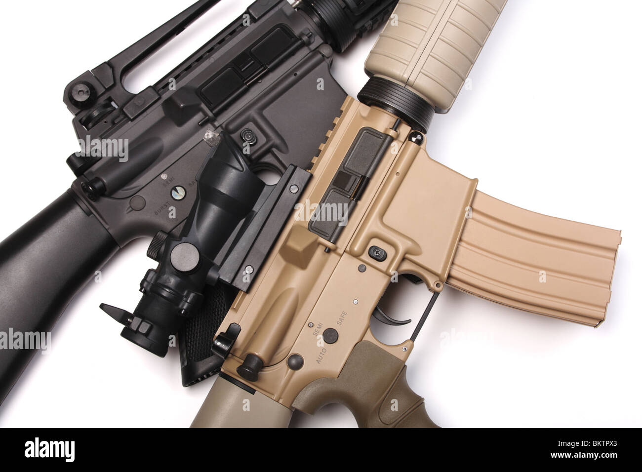 Two M16 assault rifles close-up isolated on white background. Studio shot. Stock Photo