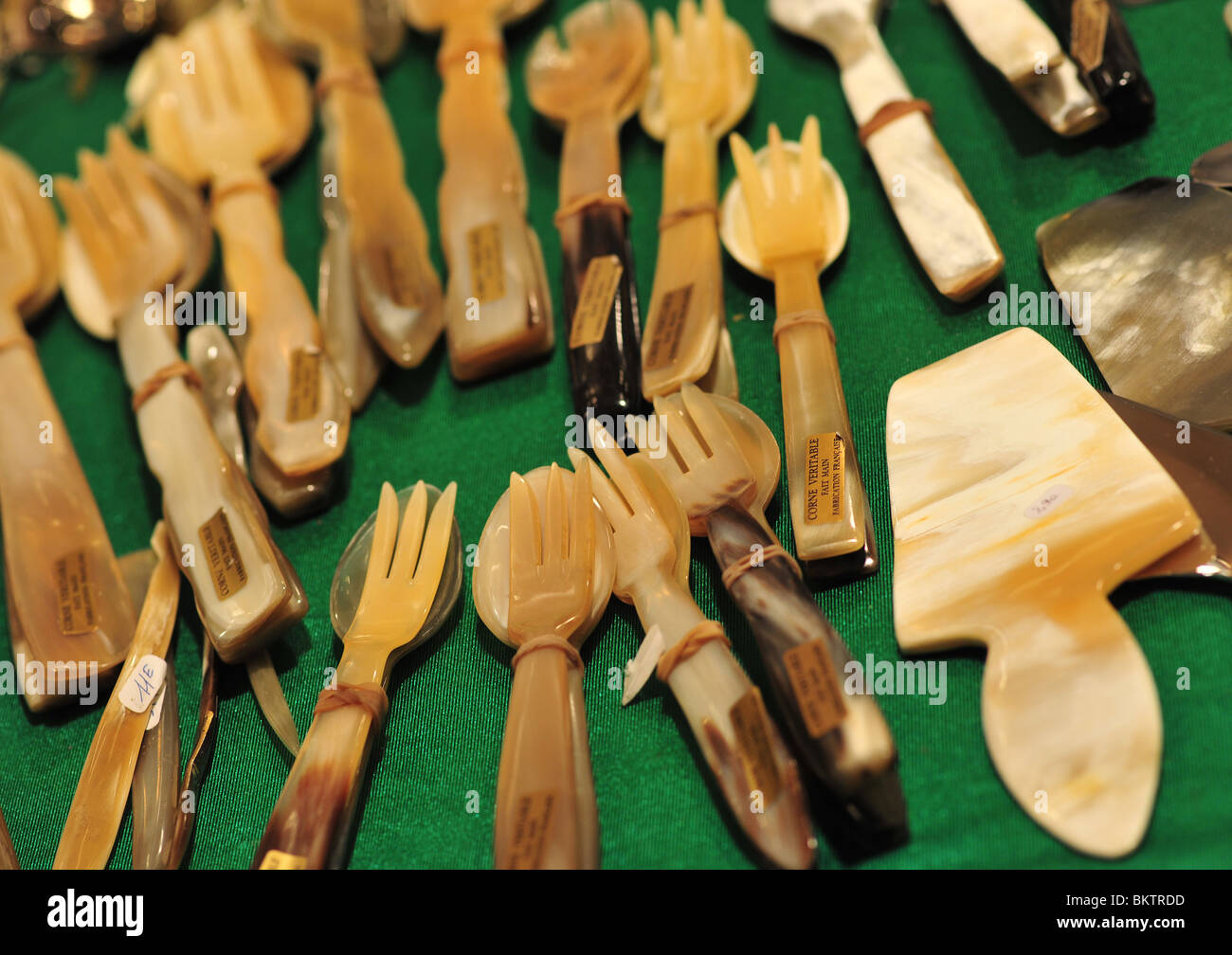 ivory utensils set on display Stock Photo
