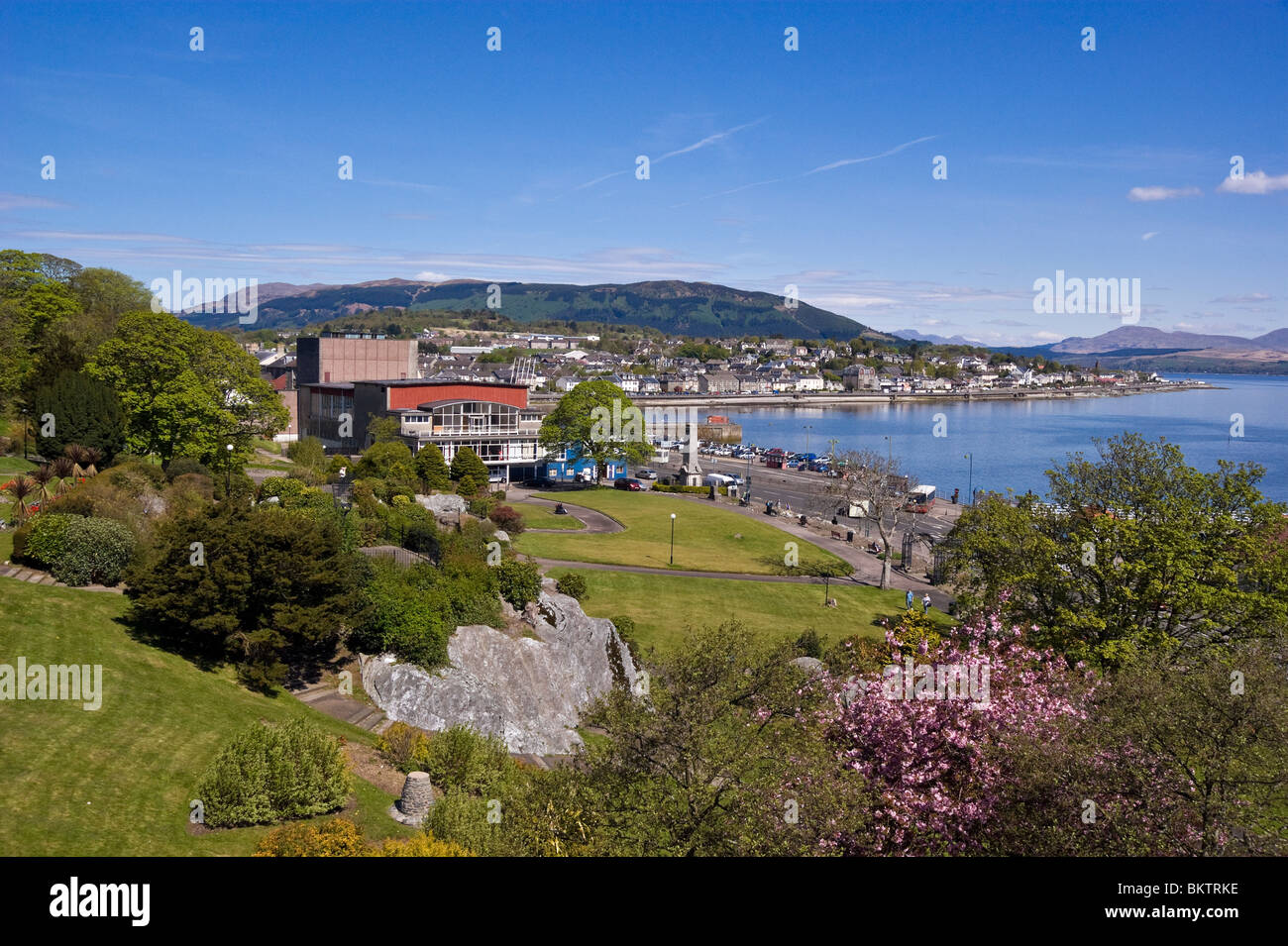 General view across Castle House gardens in Dunoon Scotland towards Hunter's Quay with War Memorial center. Stock Photo