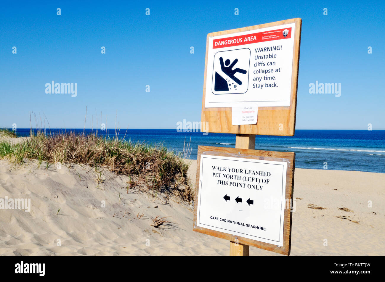 Warning sign for unstable cliffs at Coast Guard beach, Cape Cod National Seashore, Eastham, Massachusetts USA Stock Photo