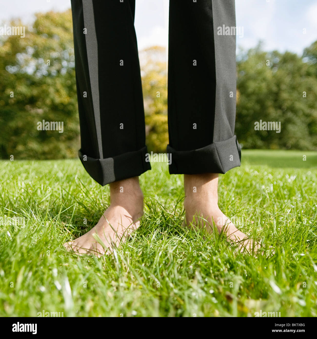 Bare feet on lawn Stock Photo Alamy