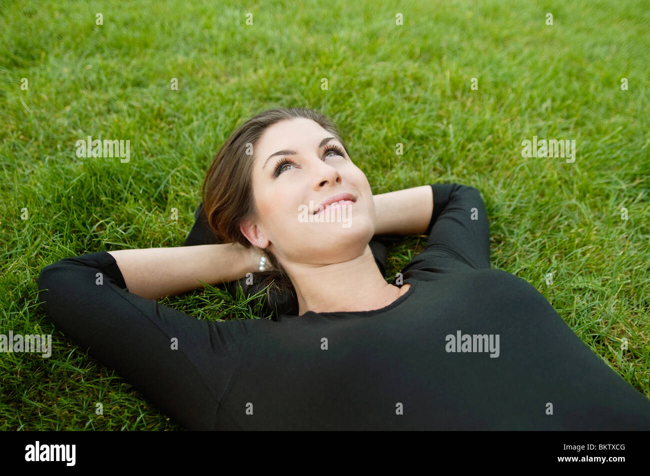 Woman Lying On Lawn Stock Photo Alamy