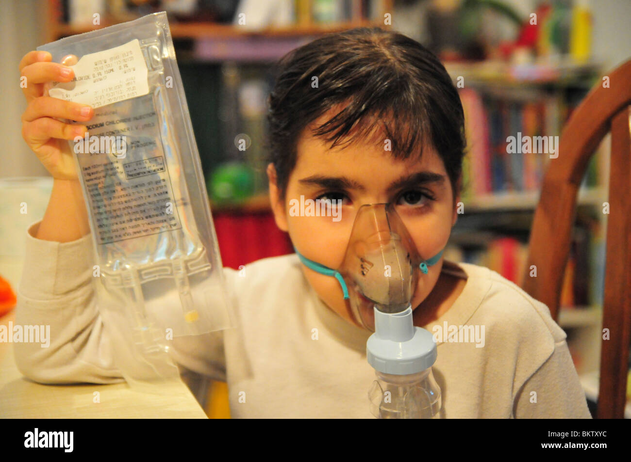 Health young girl of 8 suffers from Asthma oxygen humidifier inhaler
