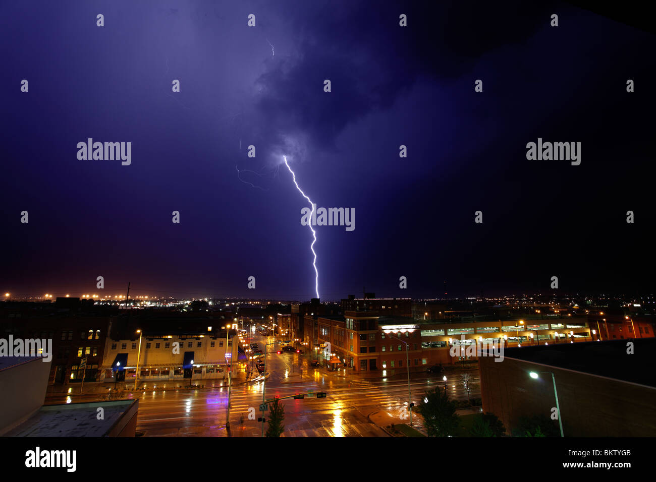 Blue lightning striking over a downtown area. Stock Photo