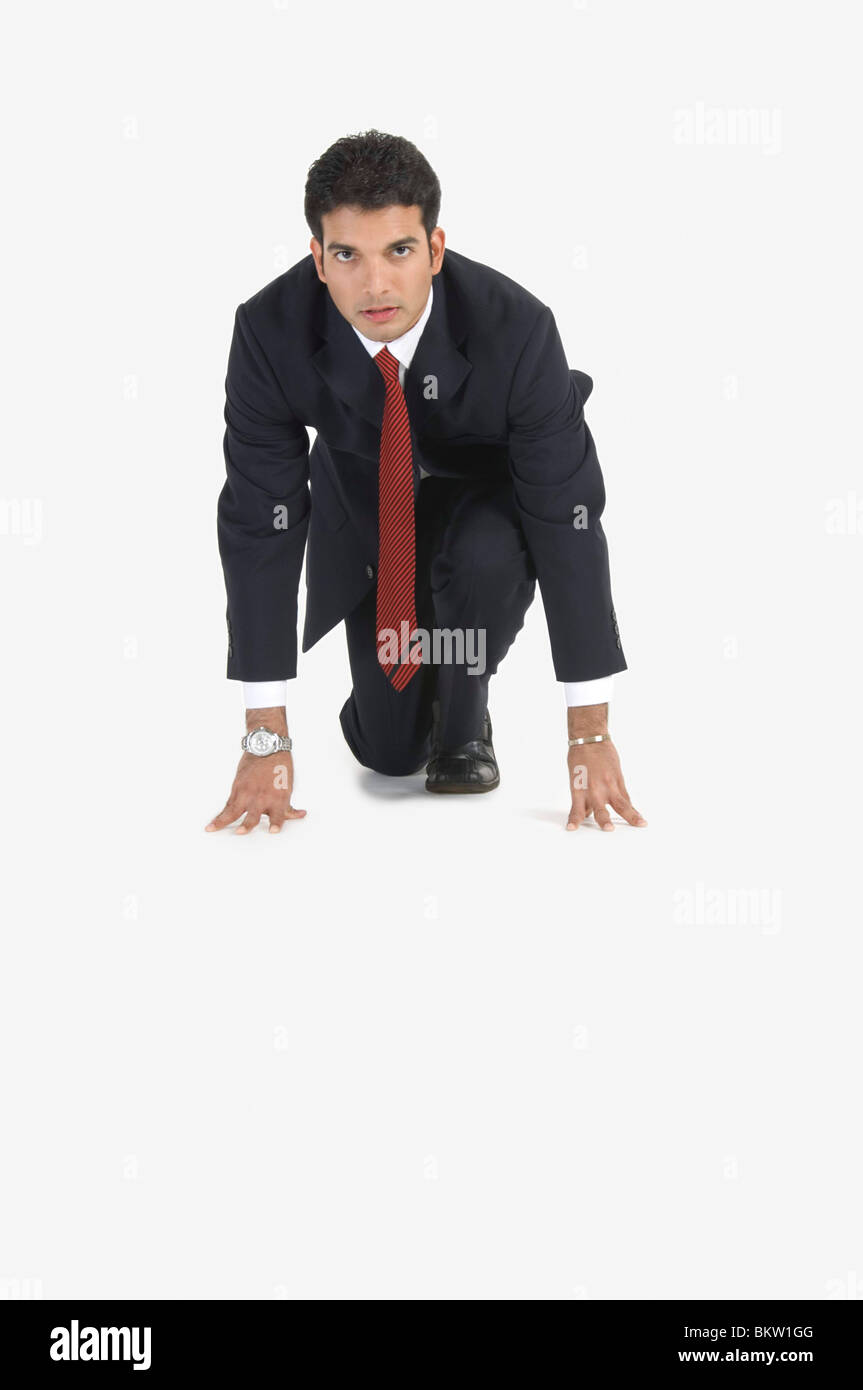 Business man in suit kneeling hi-res stock photography and images - Alamy