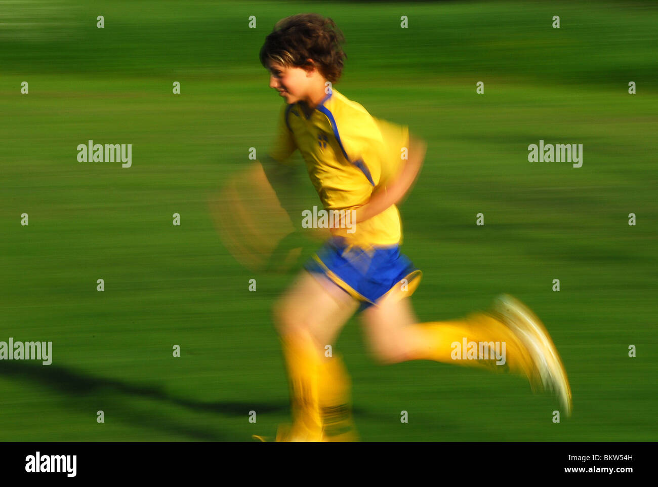 Soccerplayer running Stock Photo