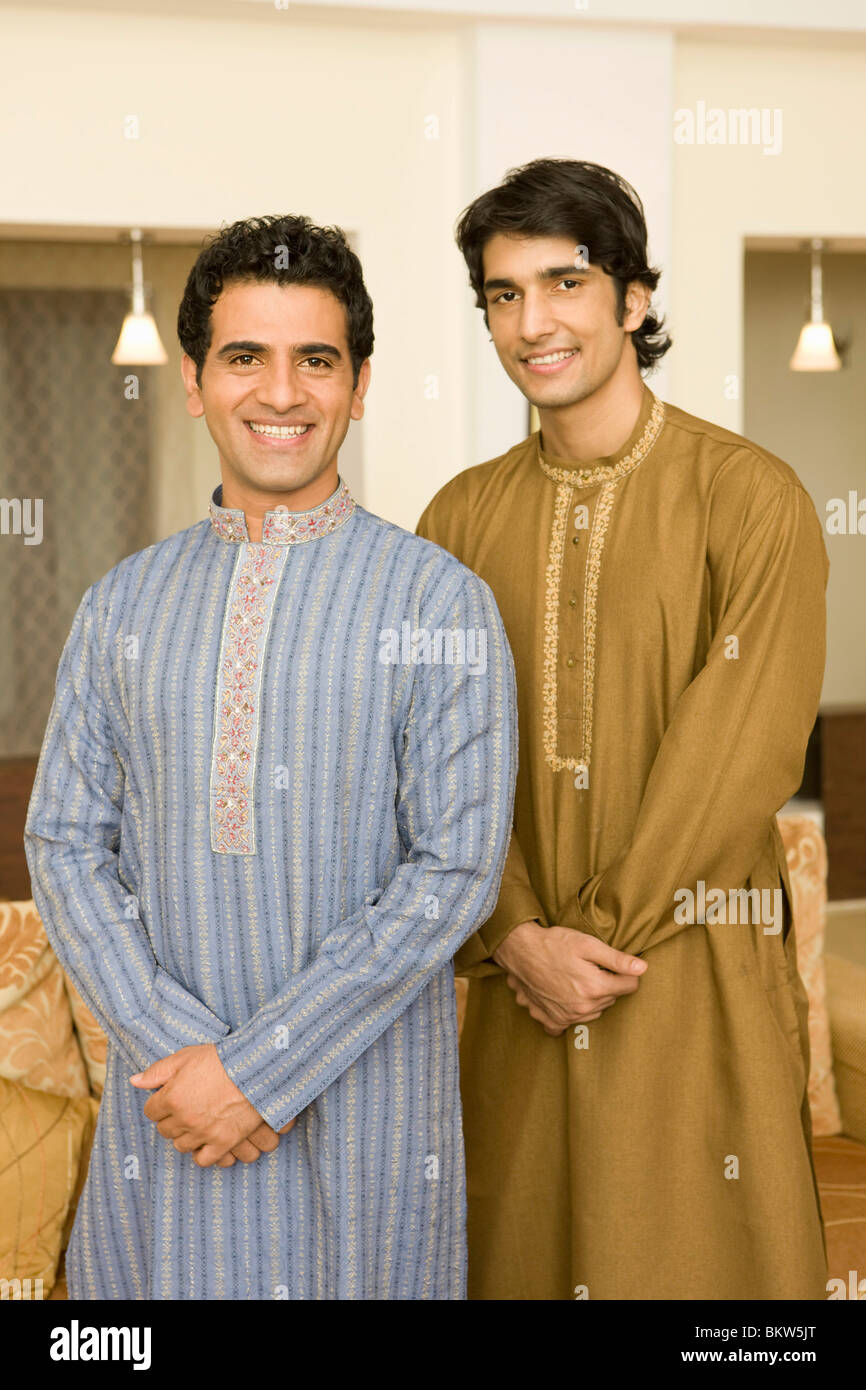 Two men wearing traditional clothes standing, smiling Stock Photo - Alamy
