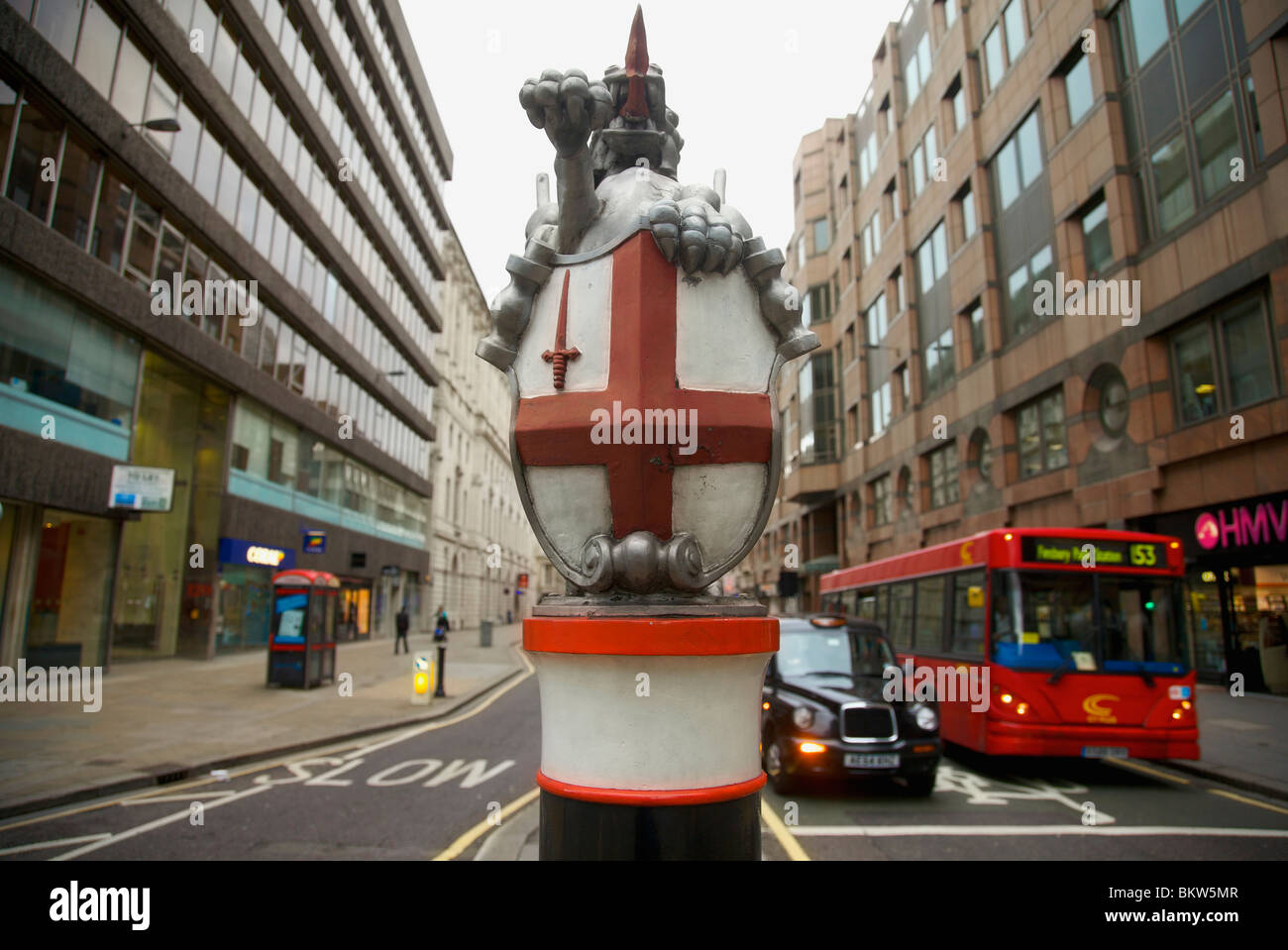 A city of London dragon boundary marker in the centre of the road at Moorgate London Stock Photo