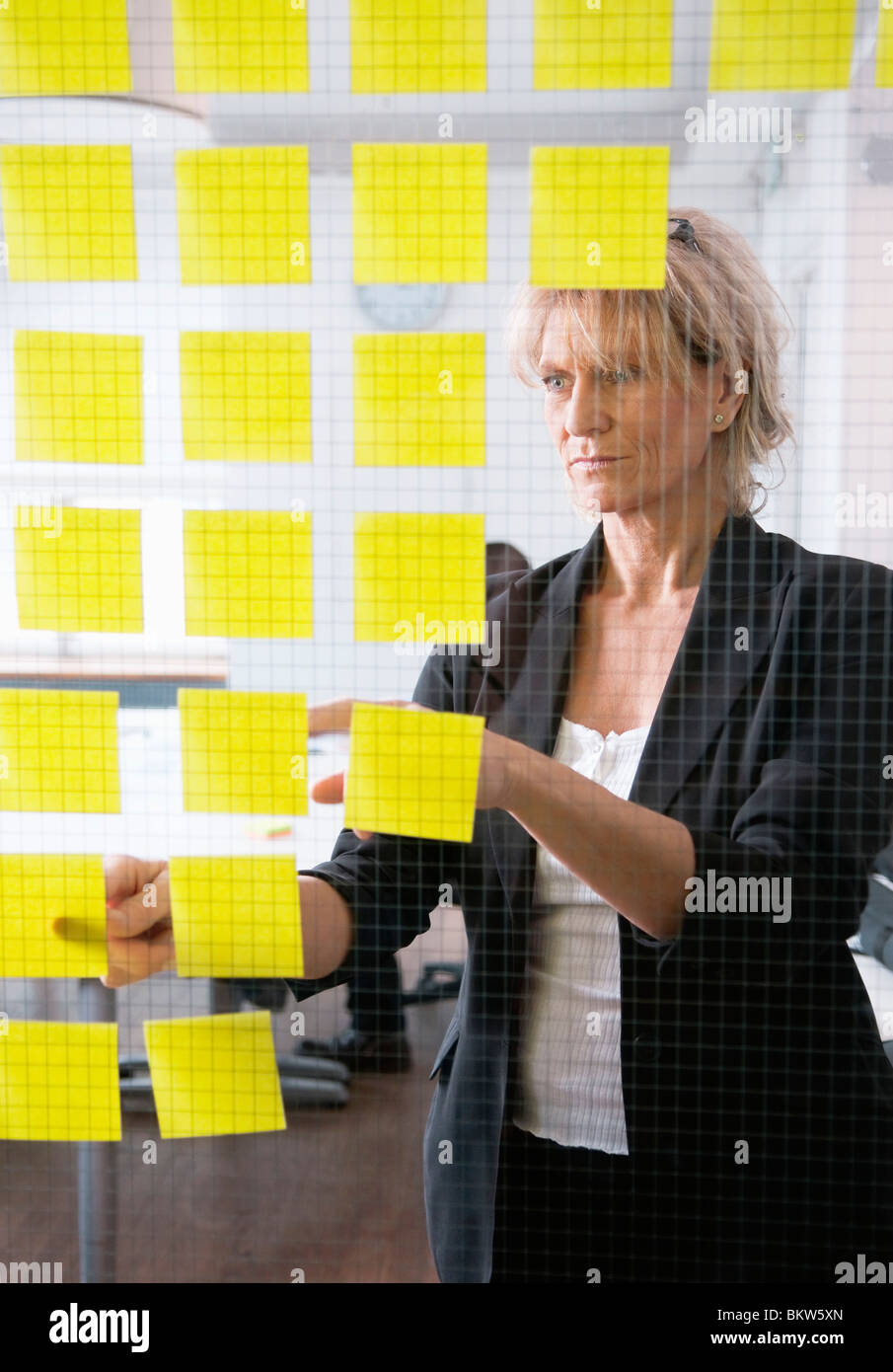 Woman with post-it Stock Photo