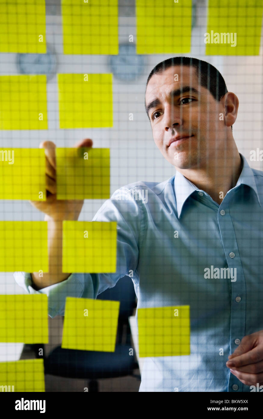 Man with yellow post-it Stock Photo