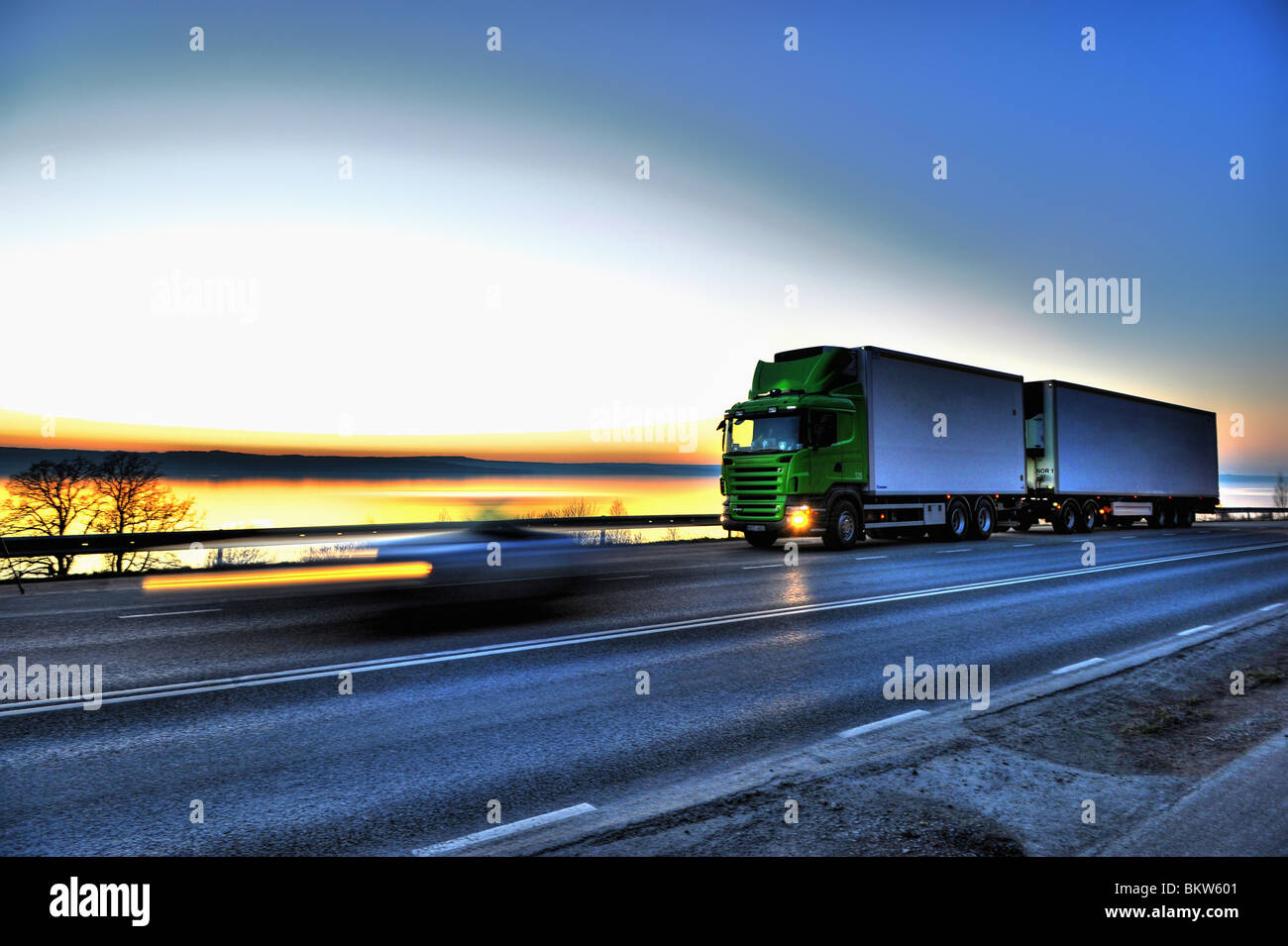 Long-distance lorry against sky Stock Photo