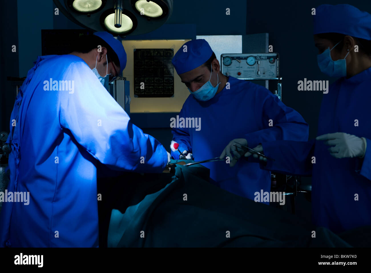Surgical team doing operation patient hi-res stock photography and ...