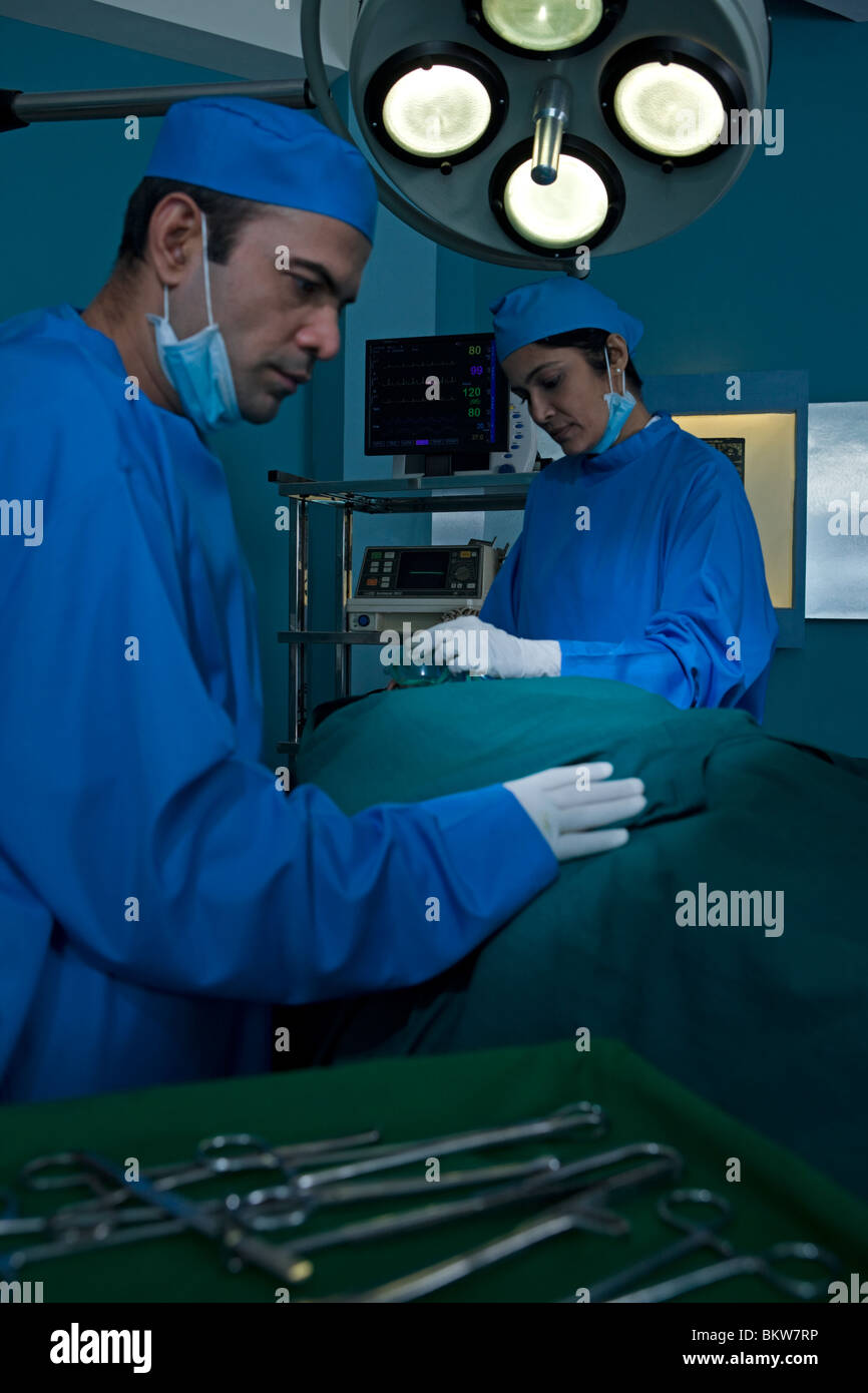 Two surgeons performing an operation Stock Photo - Alamy