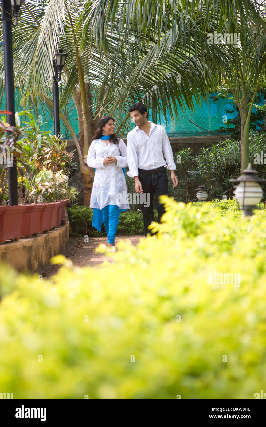 Young couple walking in park Stock Photo - Alamy