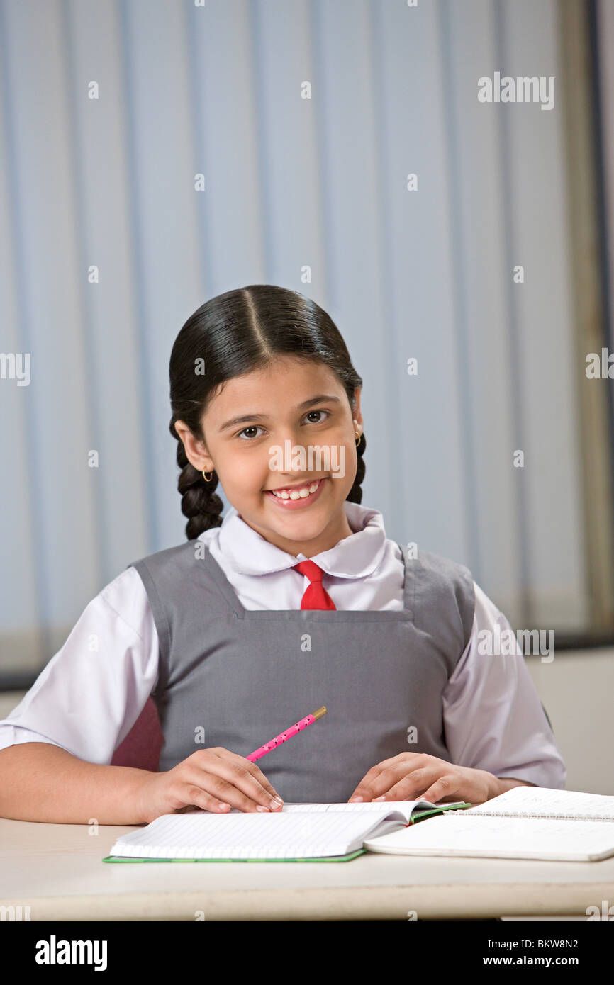 One school girl studying, looking at the camera Stock Photo - Alamy