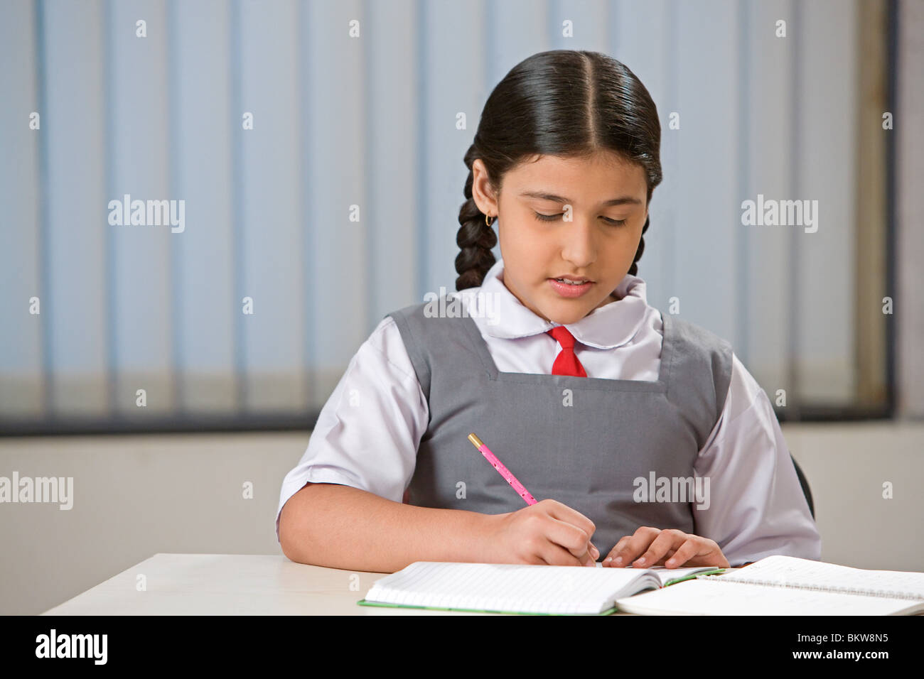 One school girl studying Stock Photo - Alamy