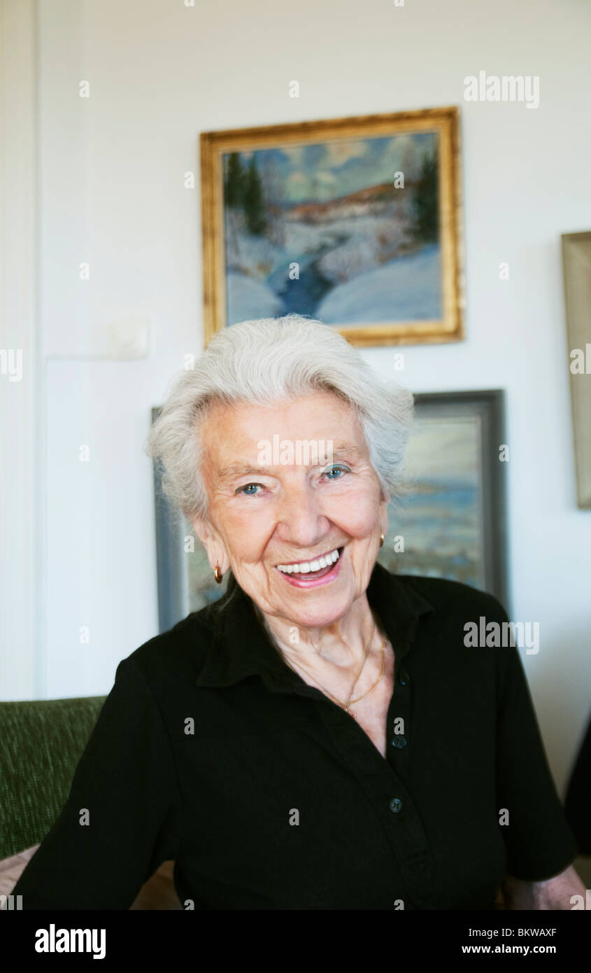 Elderly woman in apartment Stock Photo
