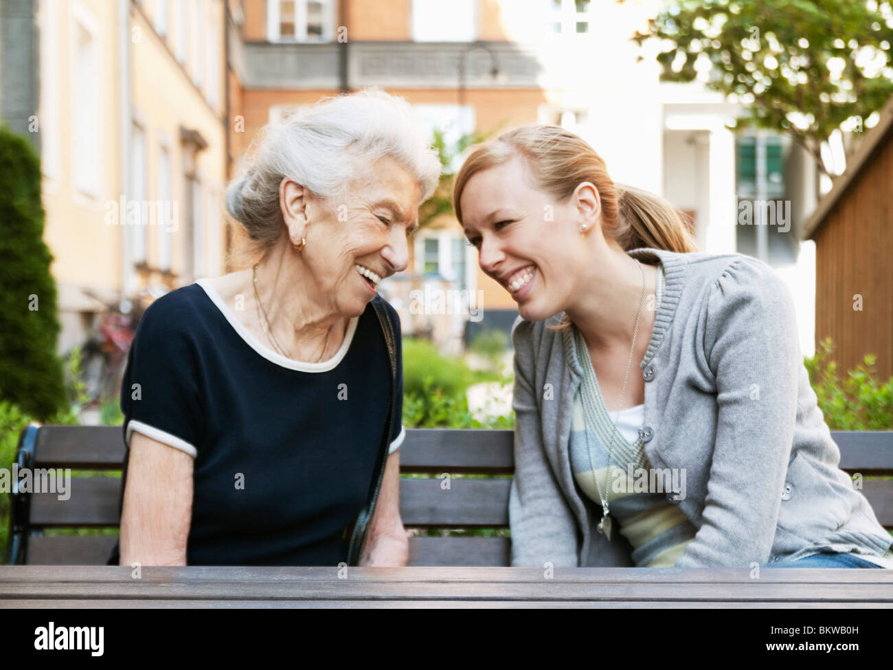 Two women sitting at a table hi-res stock photography and images - Alamy