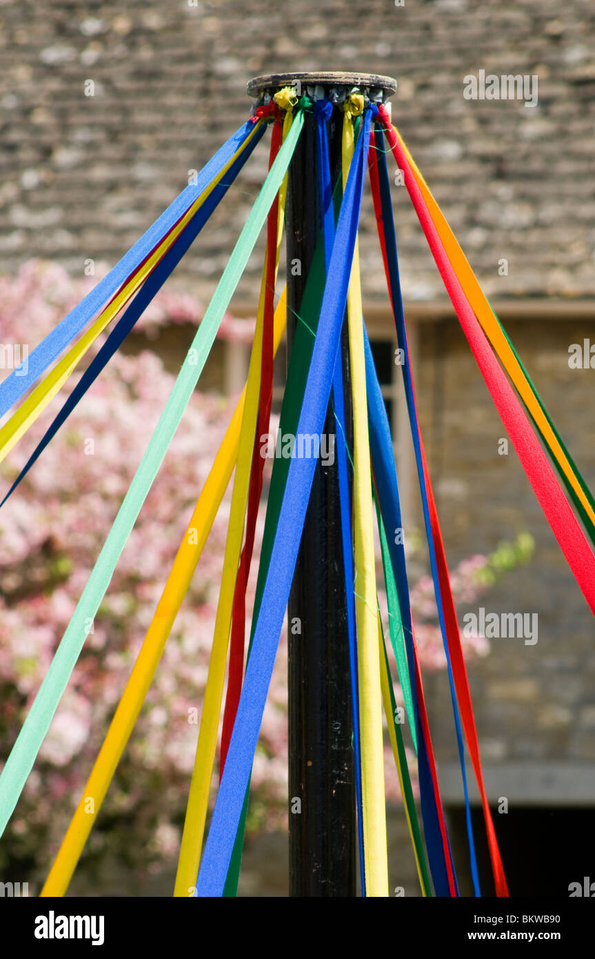 The top of a maypole with coloured ribbons Stock Photo