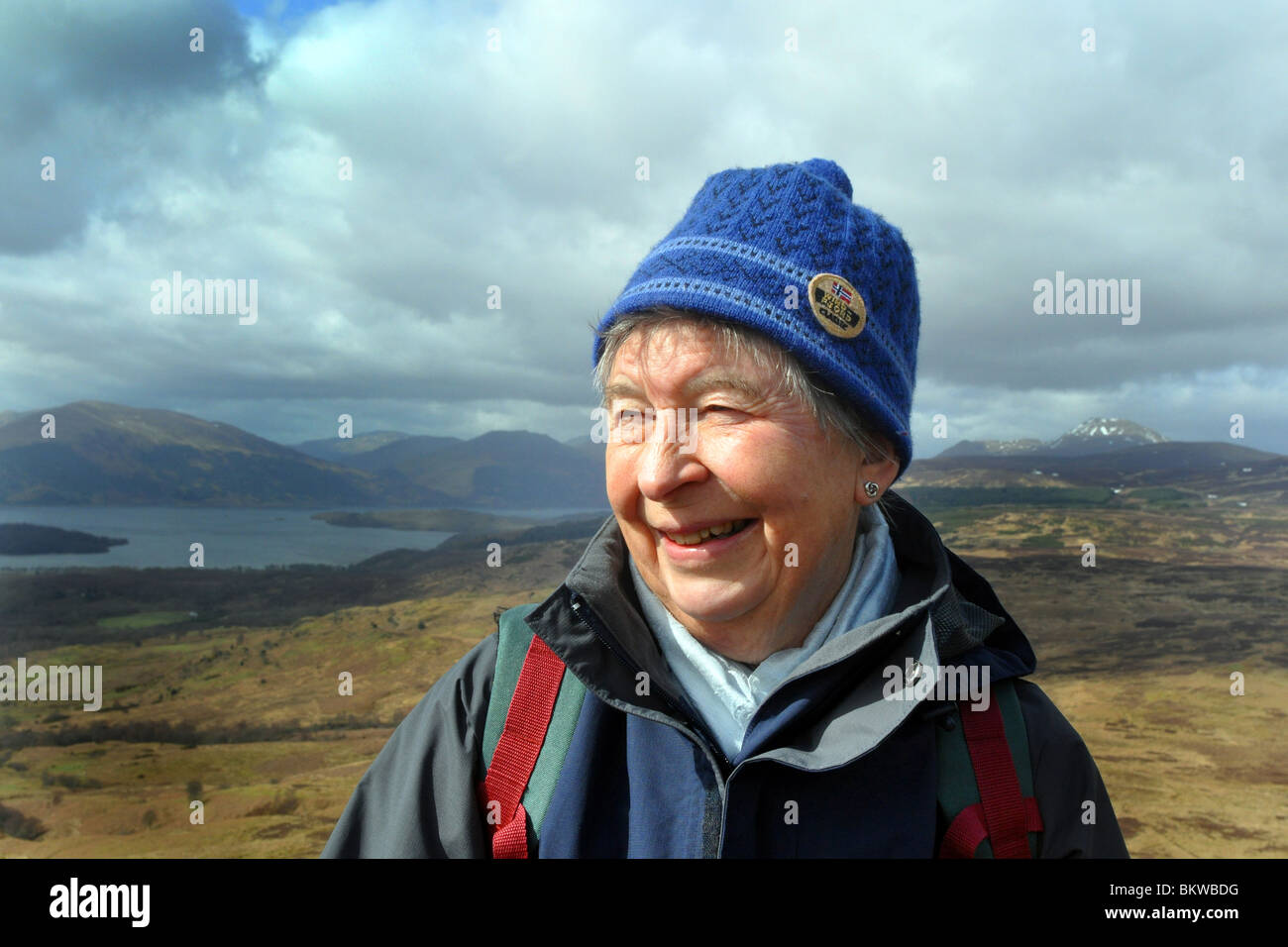 Active elderly people go hill walking in the Trossachs National Park, Scotland Stock Photo