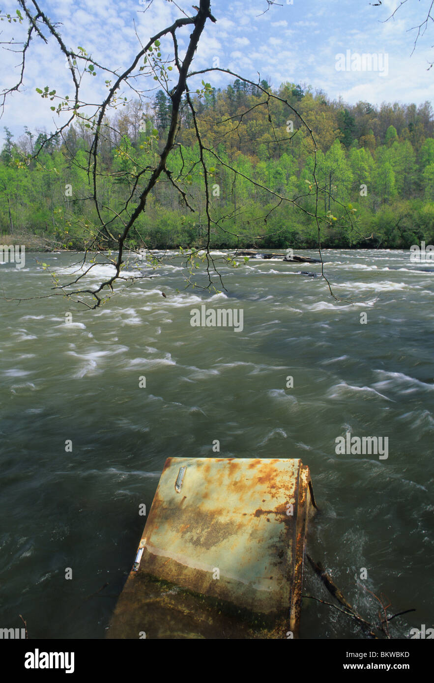 Water Pollution, old Refrigerator dumped in a mountain river Southeastern United States Stock Photo