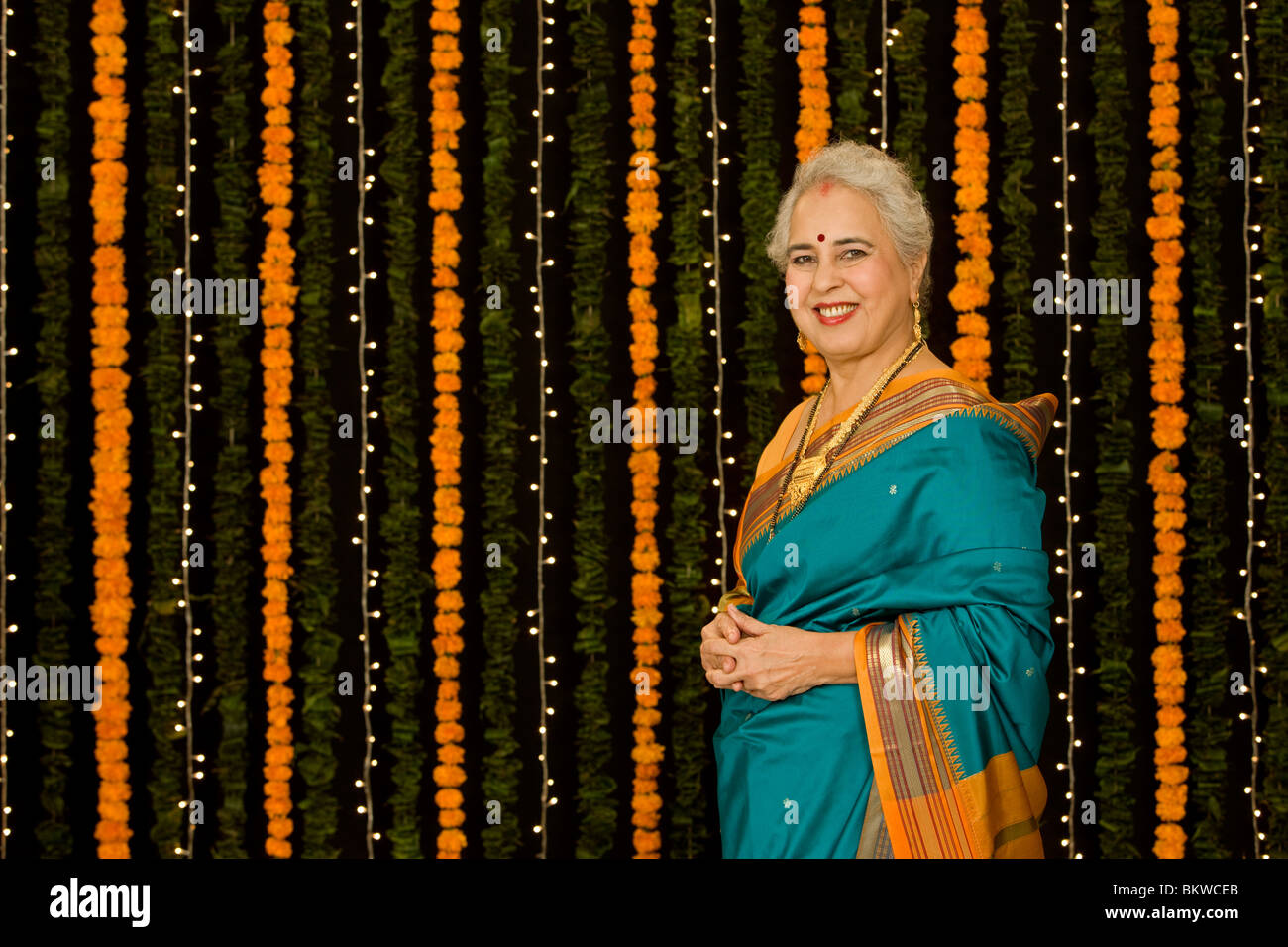 Senior indian woman wearing saree hi-res stock photography and images ...