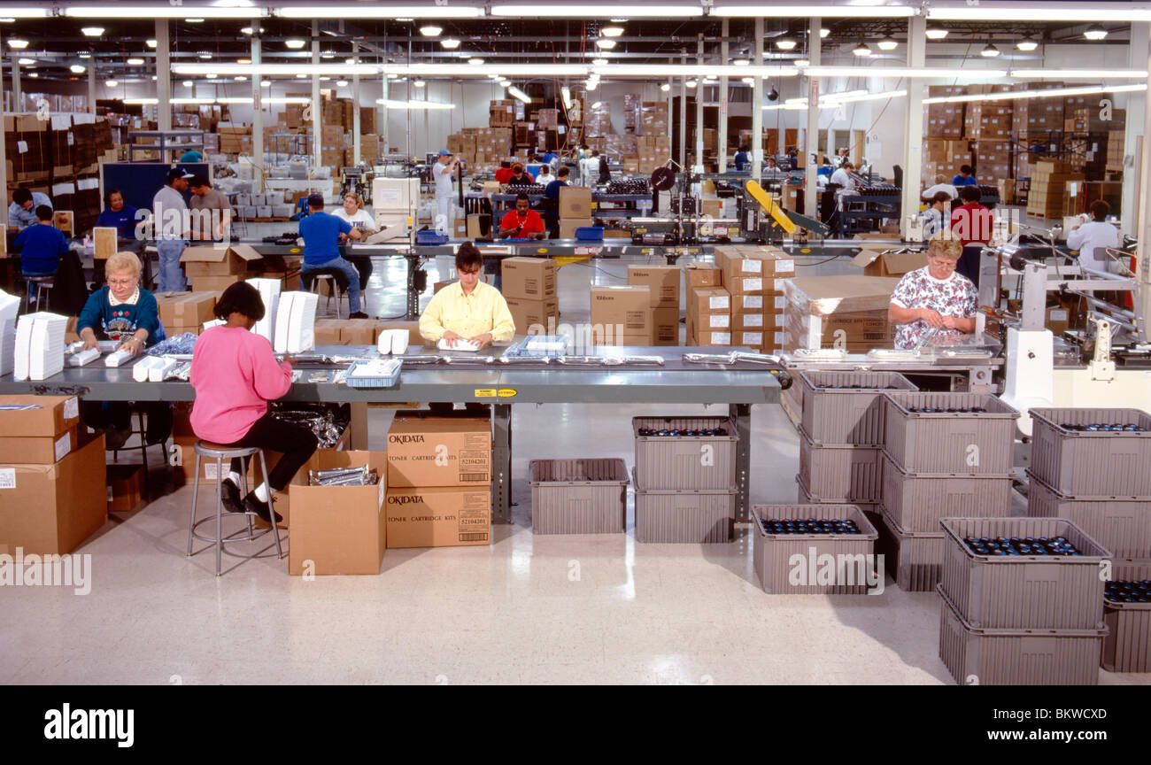 Workers at a computer manufacturing assembly plant Stock Photo