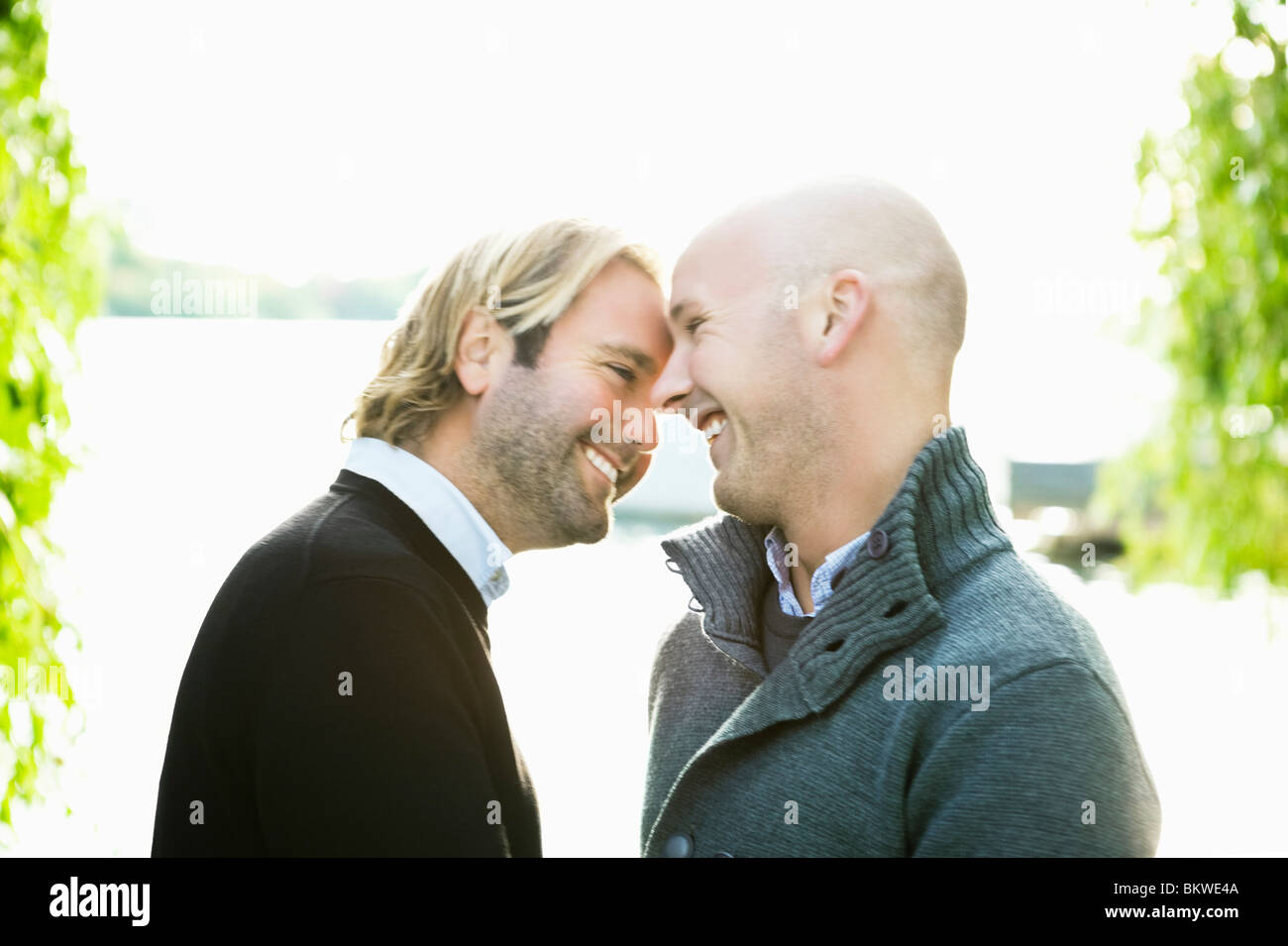 Two smiling fags by water Stock Photo