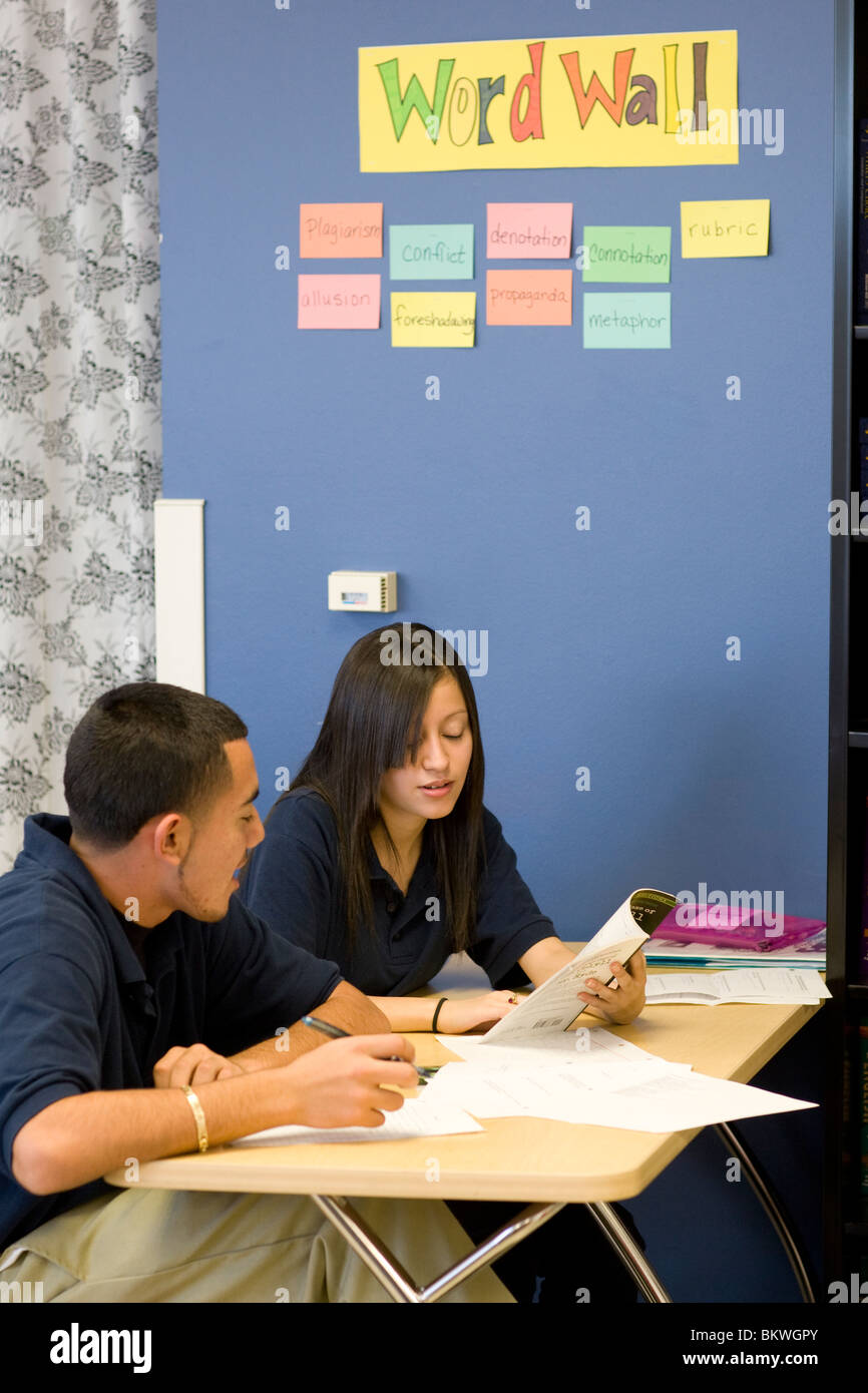 Male and female high school students discuss an assignment at charter school Peak Preparatory Academy in Dallas, Texas, Stock Photo