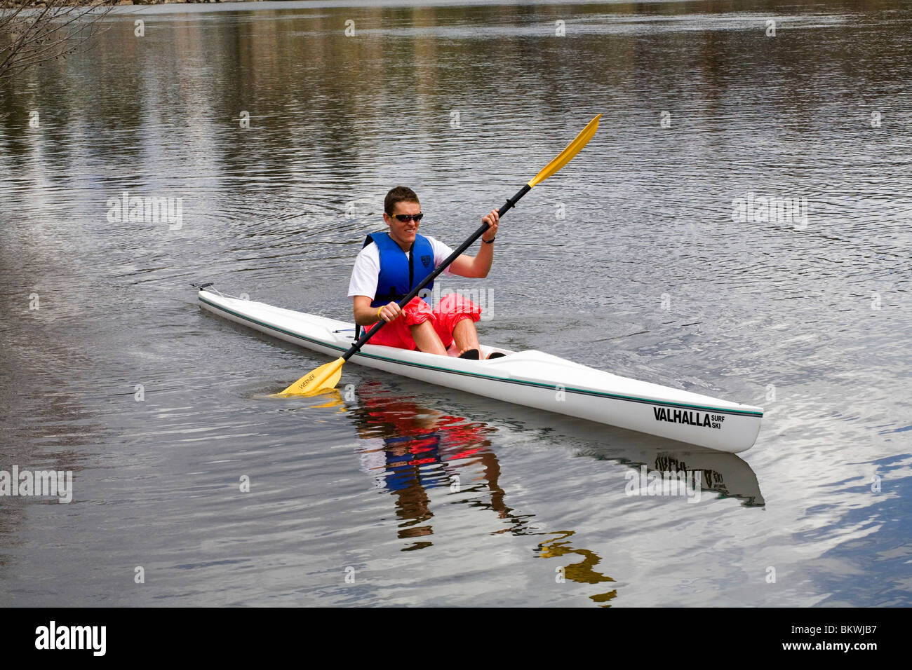 A man paddling a surf ski on the Deschutes River in Bend, Oregon Stock Photo