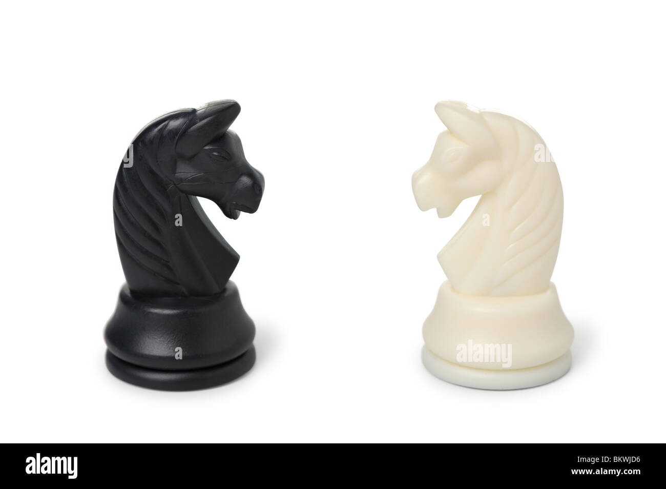 Chessmen - horses. Concept of dispute. It is isolated on white Stock Photo