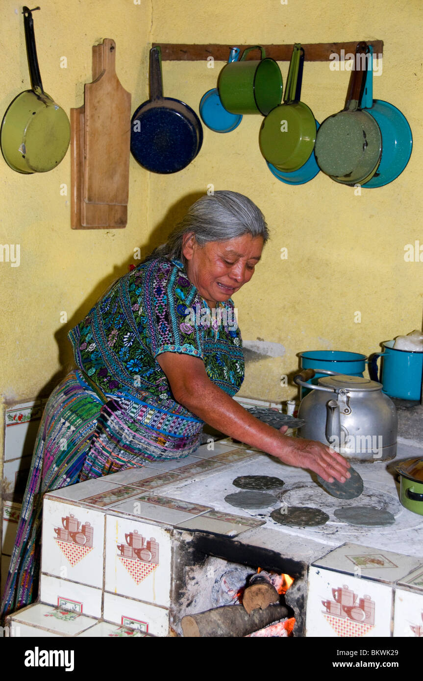 Mayan Indigenous woman making tortillas oven Guatemala Stock Photo