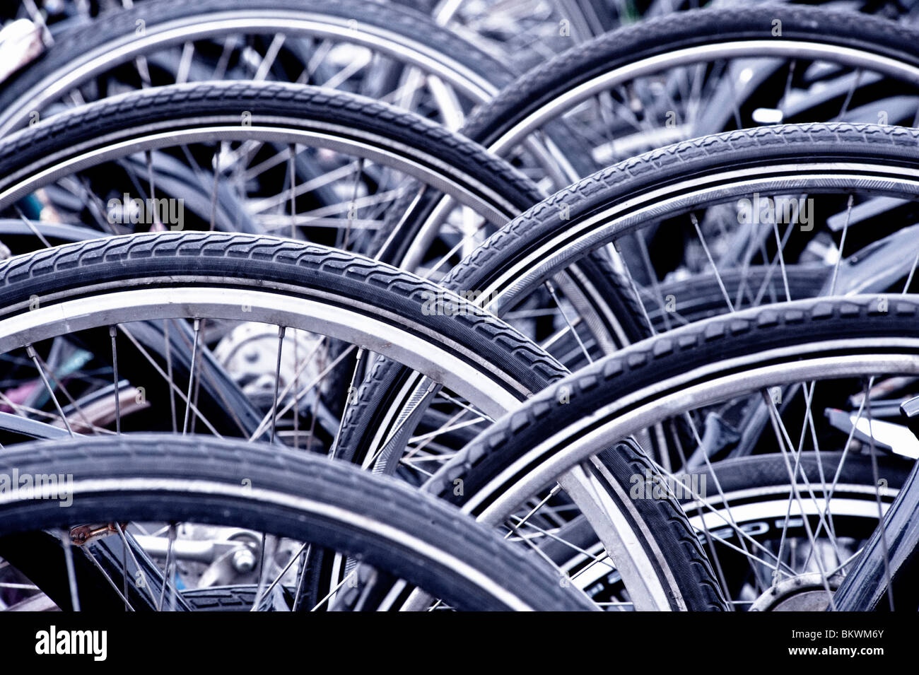 Many bicycles parked outside in city in The Netherlands Stock Photo