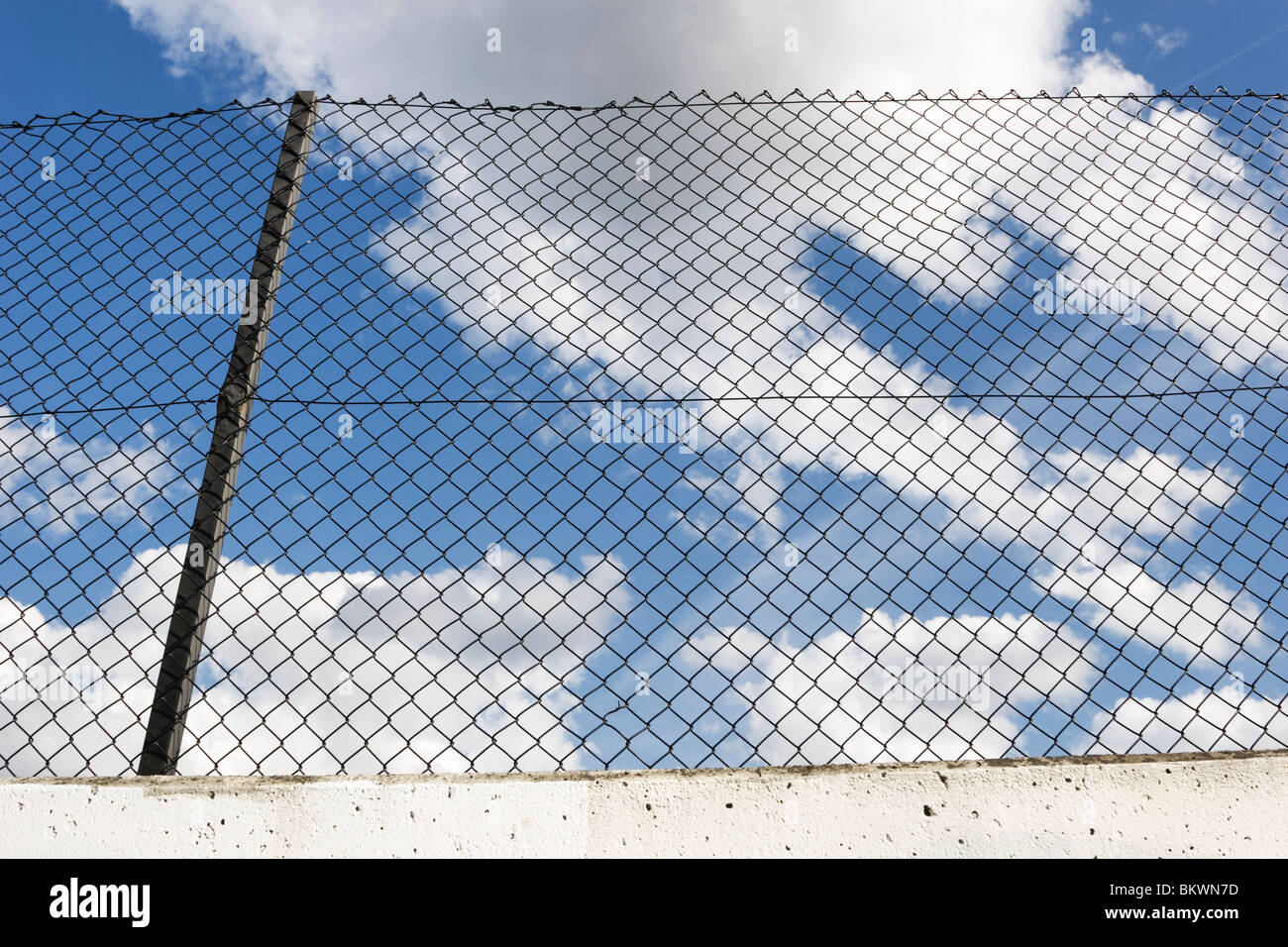 Fence with blue sky Stock Photo - Alamy