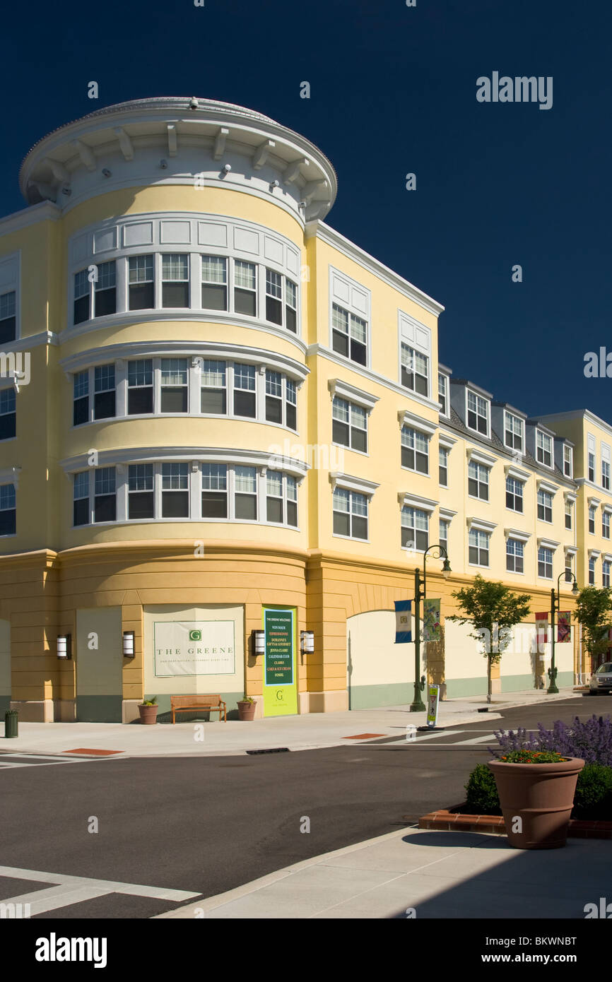 Yellow and White Building against blue sky. Round building. At The ...