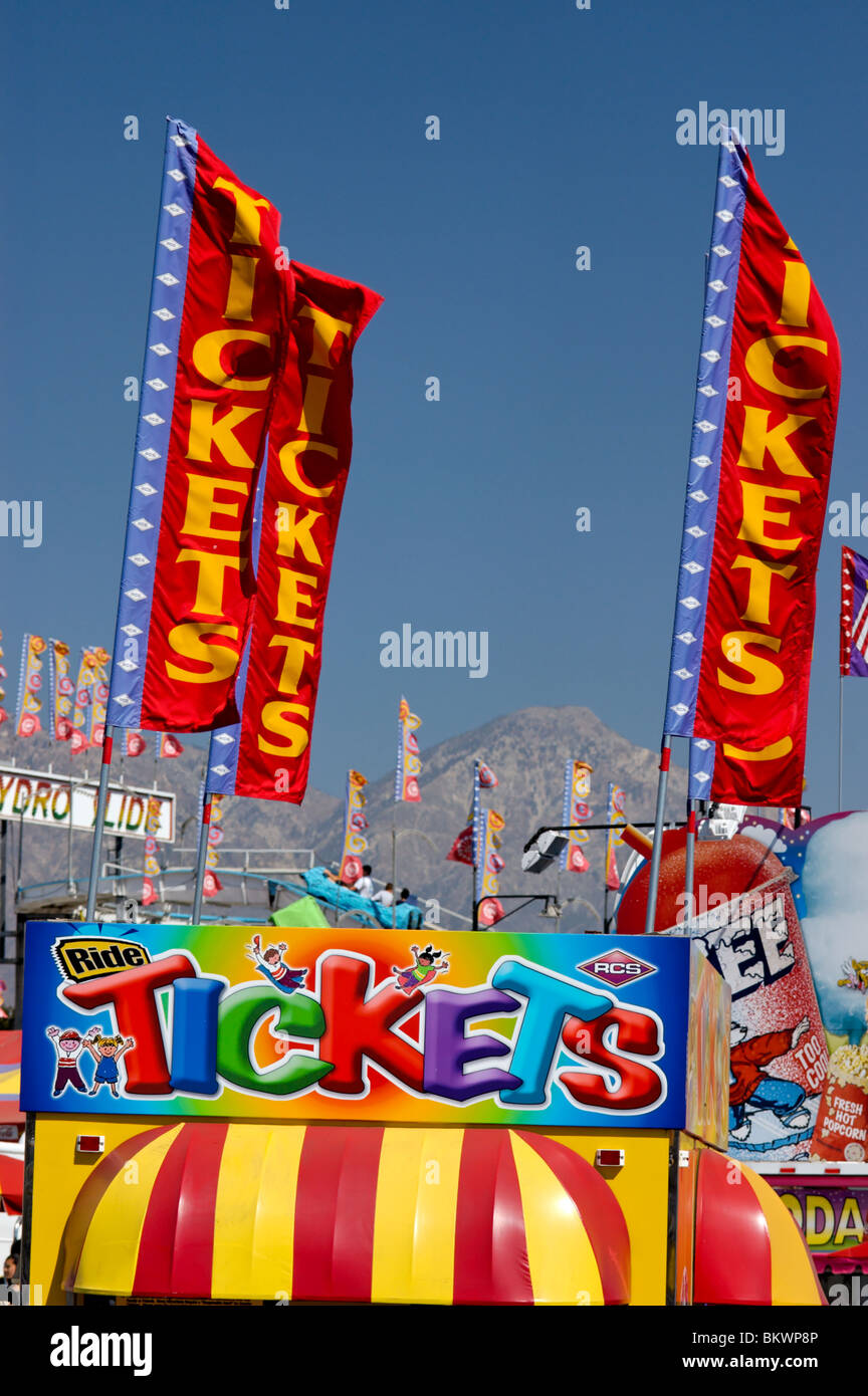 Stock photograph of a carnival ticket booth and flags, Los Angeles