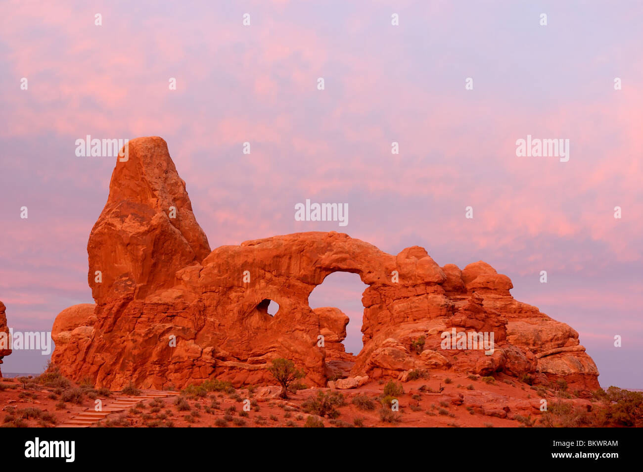Stock photograph of sunrise at Turret Arch in Arches National Park Utah USA - Stock Image