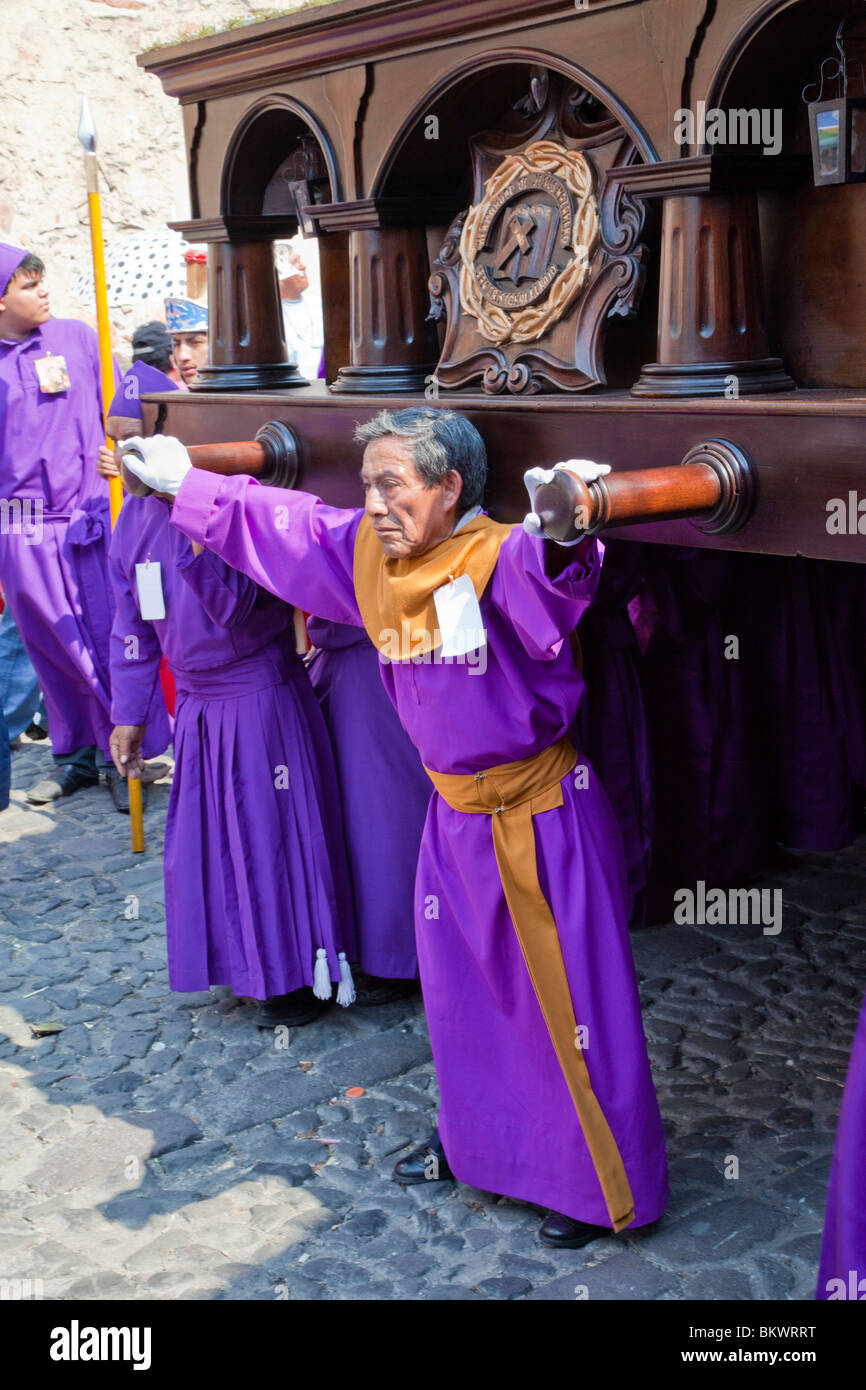 Antigua, Guatemala. A Cucurucho Leads a Religious Procession through Antigua's Streets. Stock Photo