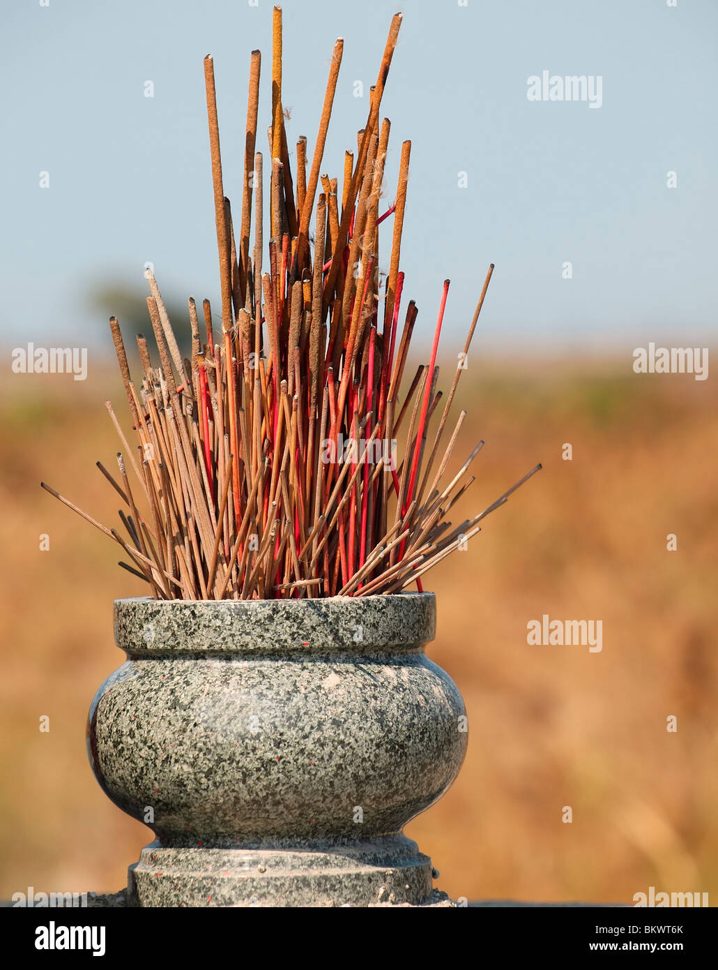 Incense holder made from granite stone with half burned incense sticks  Stock Photo - Alamy