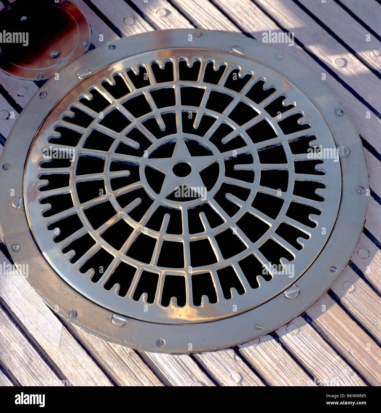 Detail of compass and hatch plate hardware on an historic sailing boat ...