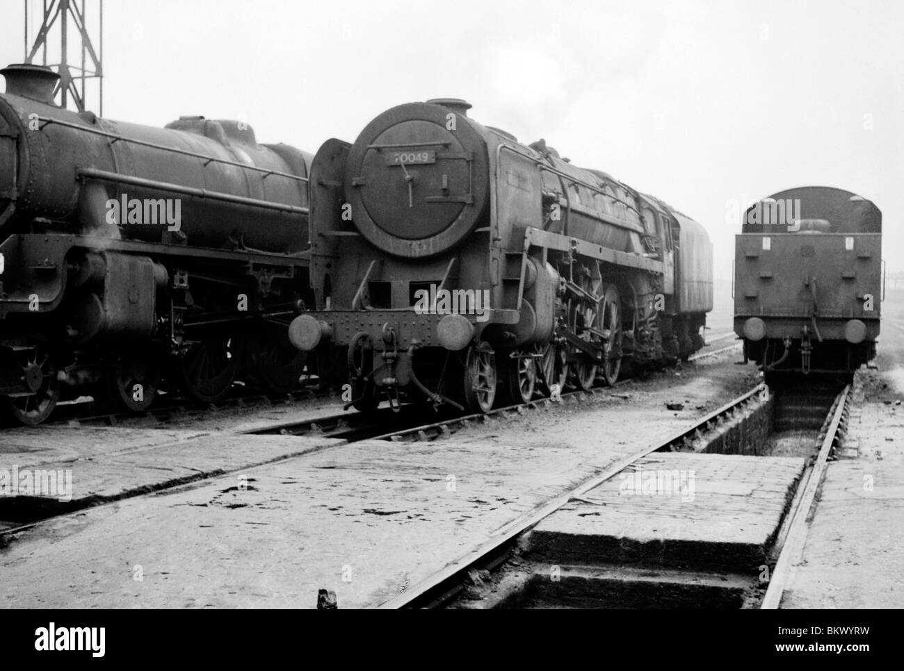 engine number 70049 britannia 7mt class stands at a depot during the last days of steam on british rail Stock Photo