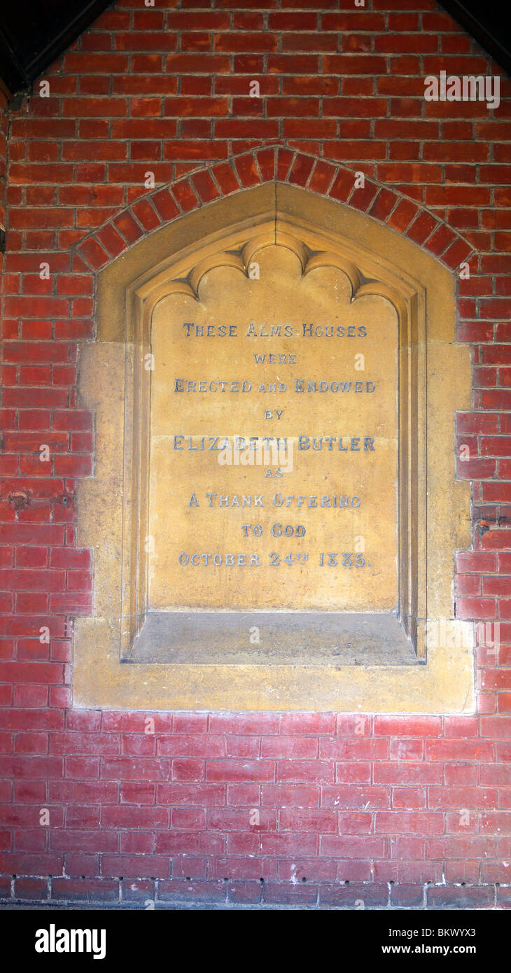 Tribute in Stone to Elizabeth Butler in the doorway of the Alms Houses she had built, Isleworth, Twickenham Stock Photo