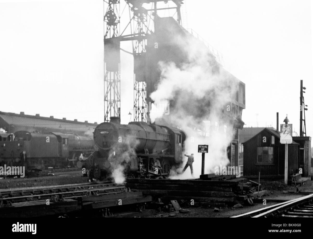 unknown engine belches smoke and steam during the final days of steam on british rail Stock Photo