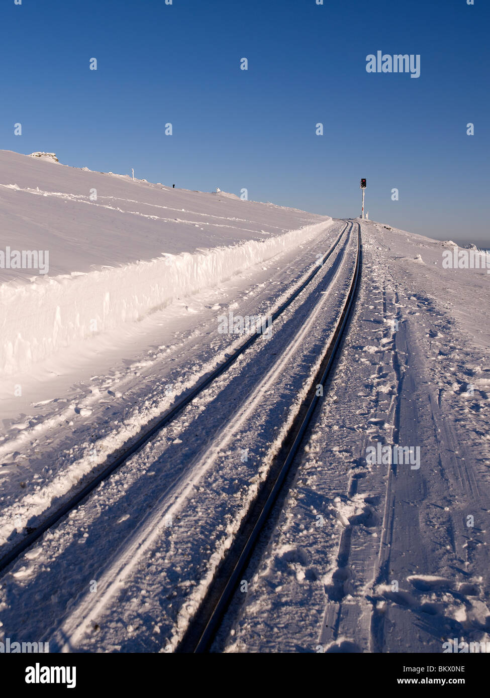 Snowy rail with signal lamp on the highest mountain of the northern part of Germany,called Brocken,Harz,Germany Stock Photo
