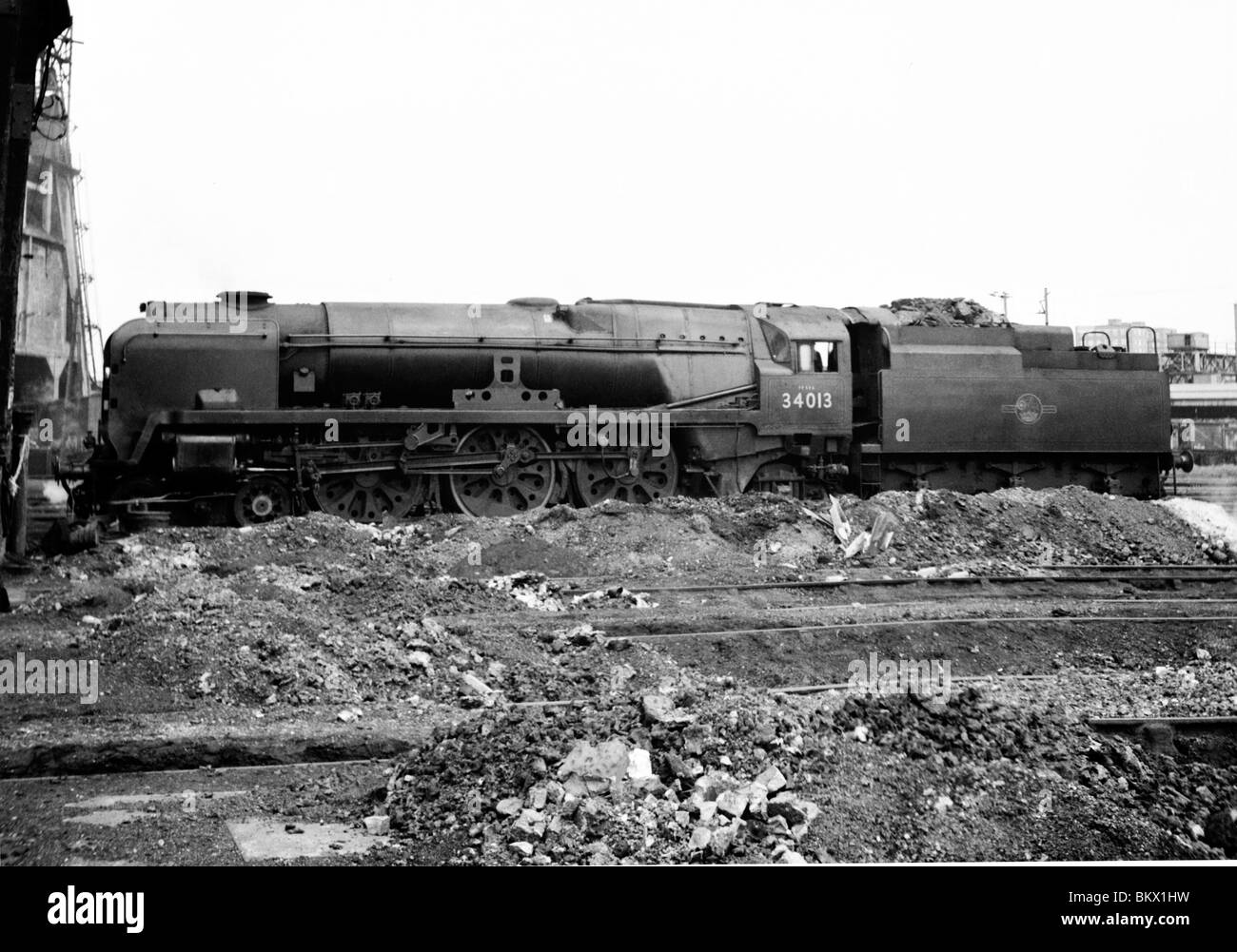 engine number 34013 okehampton west country class standing at a depot nameplate removed during the final days of steam Stock Photo