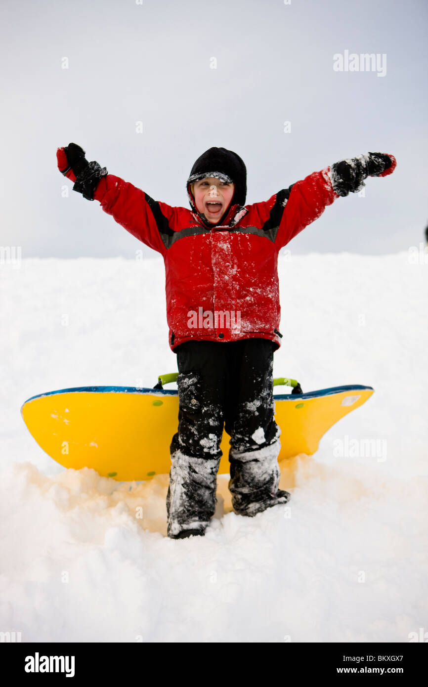 A boy having fun sledding at Wagon Hill Farm in Durham, New Hampshire