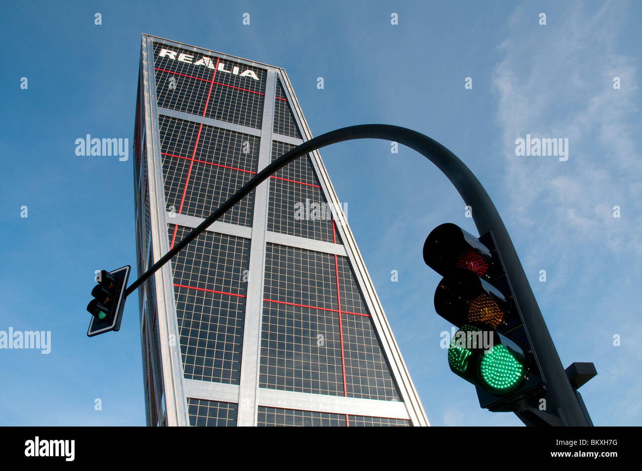 KIO Tower and green traffic light, view from below. Madrid, Spain. Stock Photo