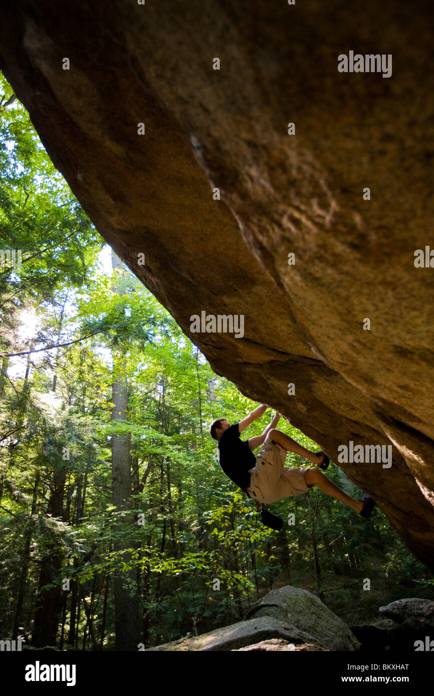 A man bouldering in "The Boulders" section of New Hampshire's