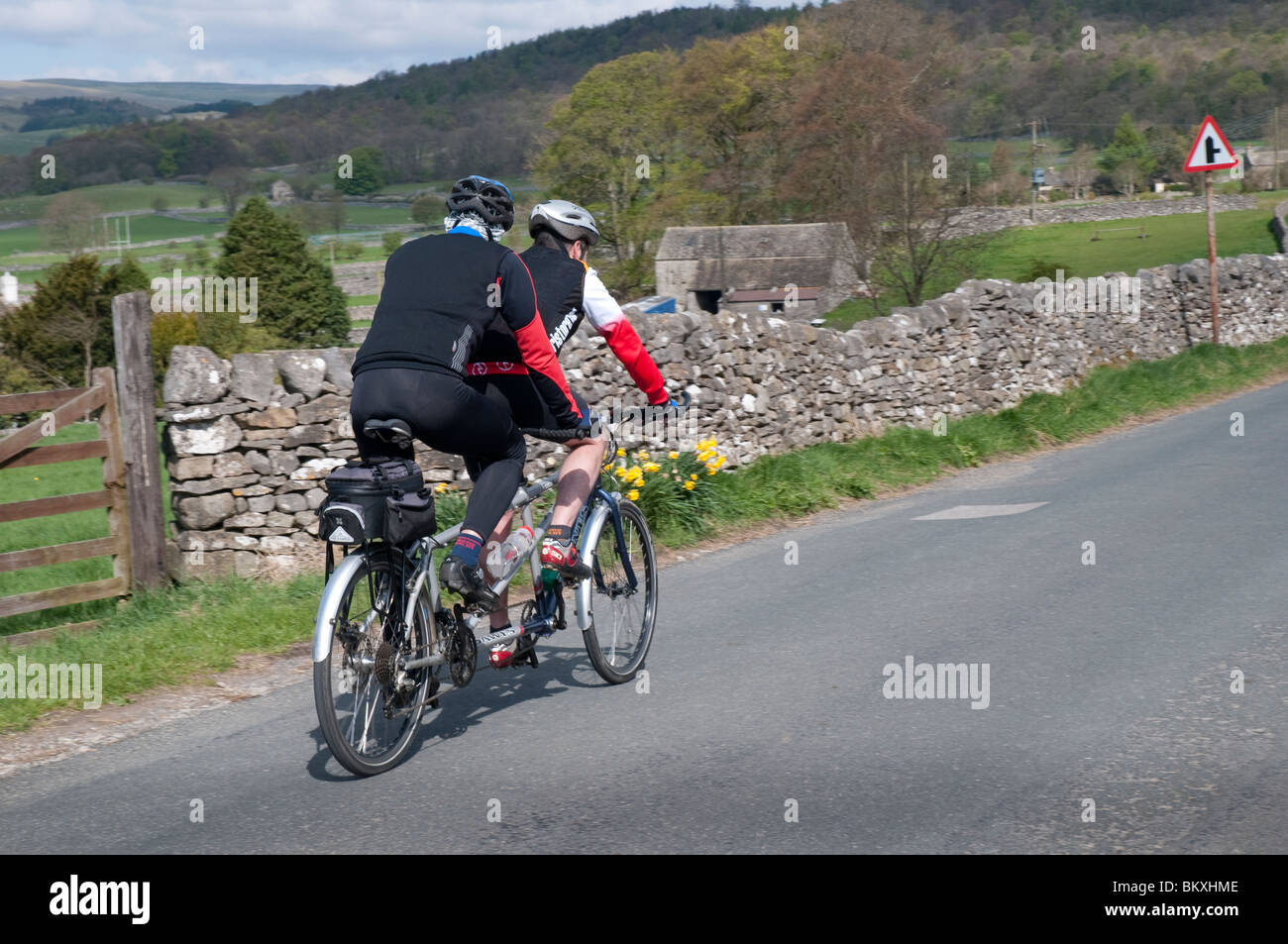 Cyclists riding a tandem near village of Grassington in the Yorkshire Dales and Linton Falls Stock Photo