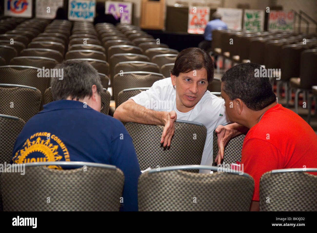 Dearborn, Michigan - Three union members in a discussion before a session at a conference sponsored by the magazine Labor Notes. Stock Photo